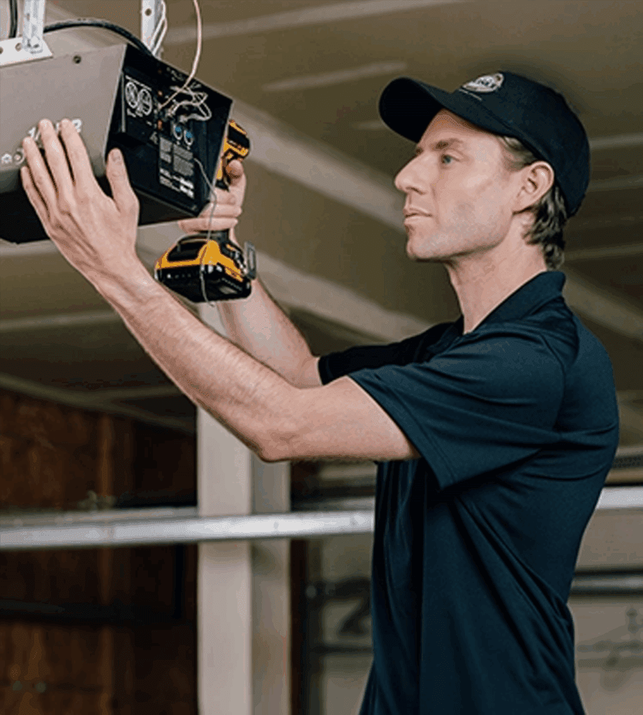 Precision Garage Door Tech fixing the Opener
